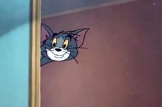 an image of a cartoon cat peeking out from behind a door with its mouth open