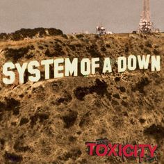 the cover to system of a down city, which is red with black lettering on it