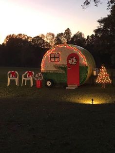 a small trailer with christmas lights on it