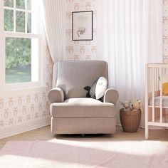 a baby's room with a rocking chair and crib