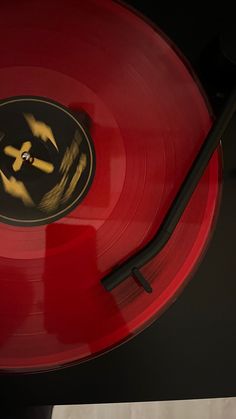 a red record player with yellow and black designs on it