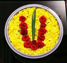 a bowl filled with yellow and red flowers