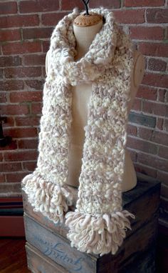 The Loopy Fringe scarf combines a seed stitch striped pattern with chunky loop fringed borders. This scarf is an easy knit, sure to keep you toasty all winter long! *This pattern is a PDF download that you will receive once payment is complete Skill Level: Beginner Knitter Materials: 2 skeins of Sister yarn in 2 different colors ~ we used Soft Ivory & Oatmeal Needle Size: US 15 straight needles Size: One size fits all ~ 94" long and 6" wide Designer: Tori Kendrew Loopy Yarn Projects, Yarn Projects Easy, Loop Yarn Scarf, Loop Yarn Projects, Chunky Blanket Pattern, Crochet Ear Warmer Pattern, Loopy Yarn, Finger Knitting Projects, Knit Collage