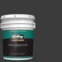 a bucket of behr paint on a blue background