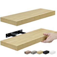 a hand holding a piece of wood with other pieces in front of it and two different colors