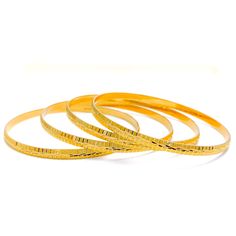 These Engraved High Finish Bangles are a must-have in any jewelry collection. Crafted from 22k yellow gold, this set of four bangles has a combined weight of 52.1 grams. The intricate engraving adds a touch of elegance to the high-gloss finish, making them a perfect statement piece. The bangles have a size of 2.8 and an opening of 2.5 inches. PRODUCT DETAILS Gold Purity(karat): 22k Gold Weight(grams): 52.1 Item Finish: Yellow Gold Bangle Size: 2.8 Bangle Opening: 2.5" Number Of Pieces: 4 Bangles Formal 22k Gold Hallmarked Bangle, Gold Hoop Bangle With Polished Finish, Gold Bangle With Polished Finish For Ceremonial Events, Ceremonial Gold Bangle With Polished Finish, 22k Gold Round Bangle For Formal Occasions, Ceremonial Polished Gold Bangle, 22k Gold Bangle For Formal Occasions, 22k Yellow Gold Bangle For Formal Occasions, Yellow Gold Round Temple Jewelry Bangle