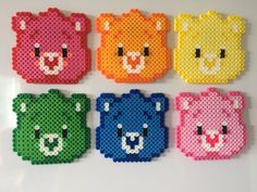 four different colored bears made out of perler beads