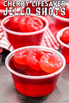 cherry jelly jello shots in plastic cups with text overlay that says cherry jelly jello shots