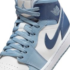 The Air Jordan 1 Mid brings full-court style and premium comfort to an iconic look. Its Air-Sole unit cushions play on the hardwood, while the padded collar gives you a supportive feel.Premium leather and synthetic upper provides durability, comfort and support.Air-Sole unit in the heel delivers signature cushioning.Rubber outsole offers traction on a variety of surfaces. Style # BQ6472-140 Color: Sail/Diffused Blue-Blue Grey Air Jordan 1 Retro Mid, Jordan 1 Retro Mid, Casual Athletic Shoes, Retro Basketball Shoes, Preppy Shoes, Nike Air Jordan 1 Retro, All Nike Shoes, Womens Air Jordans, Jordans Women