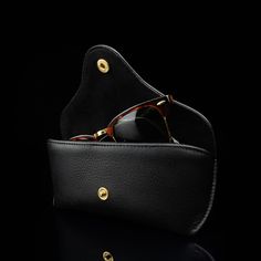 Your precious eyewear deserves the best so we designed a luxurious leather case for securely storing your glasses. The Deluxe has a classic and timeless design perfectly fit for men. Thanks to the sophisticated design, this case is fit for any occasion—from everyday wear to special occasions. The elegant and smooth velvet lining ensures that your glasses cannot be scratched while in the case, and it beautifully complements the supple leather exterior. As with all our products, we only use the fi Classic Black Cases For Formal Occasion, Classic Black Case For Formal Occasions, Elegant Daily Use Cases With Smooth Grain, Classic Black Case With Leather Lining, Elegant Cases With Smooth Grain For Daily Use, Elegant Round Business Case, Elegant Leather Case, Elegant Smooth Grain Rectangular Case, Elegant Rectangular Case With Smooth Grain