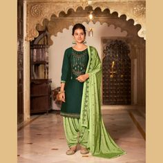 Designer Patiala Suit - Chiro's By Jigyasa Green Dola Silk Churidar In Straight Kurta Style, Green Dola Silk Churidar With Straight Kurta, Green Dola Silk Lawn Suit For Eid, Fitted Green Unstitched Suit In Dola Silk, Fitted Green Dola Silk Kurta, Festive Green Dola Silk Lawn Suit, Designer Wear Green Dola Silk Churidar, Designer Green Chanderi Salwar Kameez, Green Dola Silk Churidar For Designer Wear