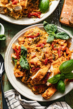 Marry me chicken pasta on a plate garnished with fresh basil.