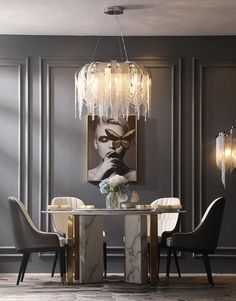 an elegant dining room with grey walls and marble table, chandelier and chairs