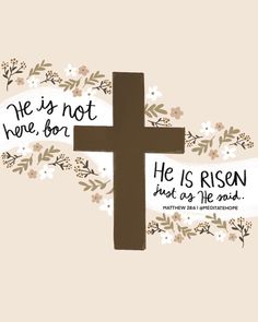 a cross with flowers and the words he is not here, but he is risen