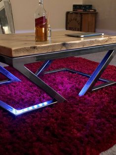 a table with some lights on it and a bottle in the backgroung