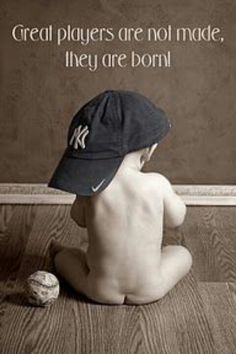 a baby sitting on the floor with a baseball cap on it's head and an image of a ball in front of him that says great players are not made, they are born