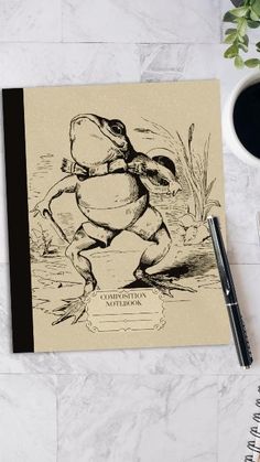 a notebook with an image of a frog on it