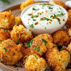 fried cauliflower with ranch dip on the side and garnished with parsley