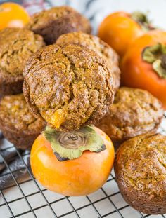 several muffins are stacked on top of each other with an orange in the middle