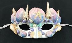 This Mystical seashell mask is made with real seashells and is hand painted. Mask is light weight and has a comfortable feel. Mask comes with white silk ribbon ties. Great for Mermaid and Fairy costumes. Sea Mask, Mermaid Mask, Elf Kostüm, Mask Project, Painted Mask, Mermaid Seashell, Fairy Costumes, Cat Spirit, Plastic Mask