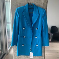 The Attico Cerulean-Blue Blazer Dress Captures A Distinct 1980’s Aesthetic With The Glittered Crystal Flower Shaped Buttons. It’s Crafted In Italy From Lustrous Cotton Blend Twill To A Double Breasted Silhouette With Padded Shoulders And Peak Lapels, Then Falls To A Thigh-Grazing Hemline. Italian Size 42 Correspond To A Medium. 1980’s Aesthetic, Wool Double-breasted Blazer Dress With Hidden Buttons, Luxury Blue Double-breasted Outerwear, Blue Blazer Dress, Luxury Single-button Blue Outerwear, Luxury Blue Button-up Dress, Luxury Blue Button-up Blazer, S Aesthetic, The Attico