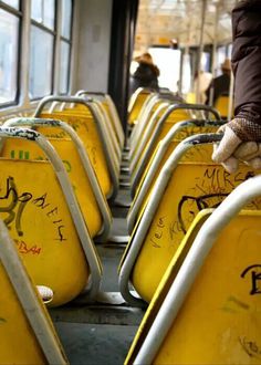 the seats are covered in graffiti on the bus