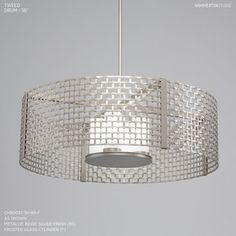 a round light fixture hanging from a ceiling