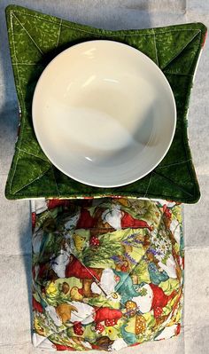 a white plate sitting on top of a green pillow