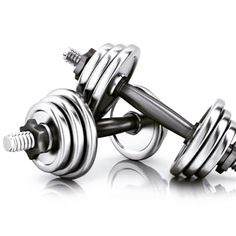 two metal dumbbells sitting on top of each other