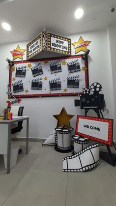 an office decorated with movie themed decorations and signs for the welcome sign to someone's business