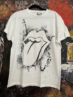 Vintage white The Rolling Stones men's T-shirt rare designed. We ship worldwide. Thank you for your shopping. White Fan Merchandise T-shirt For Summer, Summer White T-shirt For Fan Merchandise, Unisex White Graphic Design Top, Unisex White Graphic Tops, White Graphic Design Unisex Tops, White Crew Neck T-shirt Band Merch, White Printed T-shirt For Band Merch, White Graphic T-shirt For Fan Merchandise, Unisex White T-shirt With Graphic Print