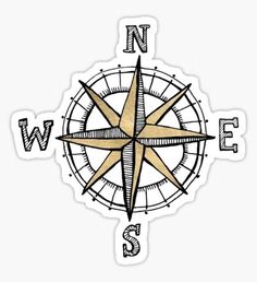 a compass sticker with the word'n e in black ink on white paper