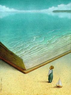 an open book sitting on top of a beach next to a person standing in the sand