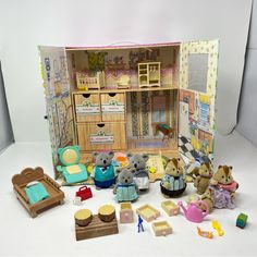 there is a doll house with toys in it