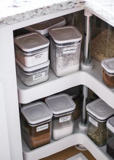 an organized pantry with containers and food in it