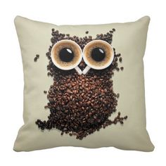 an owl made out of coffee beans with eyes