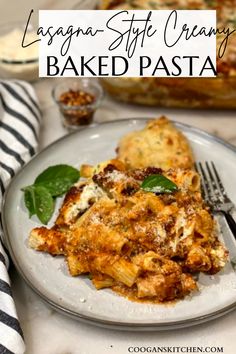 lasagna - style creamy baked pasta on a plate with basil leaves and a fork