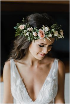 a woman wearing a flower crown on her head