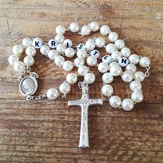 "Personalized rosary for women and girls with white beads. Send us a note with the name or initials you want on rosary. Rosary is 27 inches (70 cm) long on the necklace part, so it will fir adults as well as teens or kids. Handmade by our family in Medjugorje. Using 6 mm simulated pearl beads on a chain link. Centerpiece is a medal of Virgin St Mary, and crucifix is silver dipped with engraved \"Medjugorje\" and \"Mir Mir Mir\" on the back, which is Croatian for \"Peace Peace Peace\". Each rosar Virgin Mary Rosary, Wedding Rosary, Personalized Rosary, Custom Gift Cards, Pearl Rosary, Catholic Rosary, Rosary Necklace, Rosary Catholic, Simple Bracelets