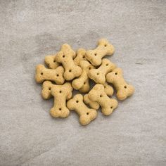 a pile of dog biscuits sitting on top of a cement floor