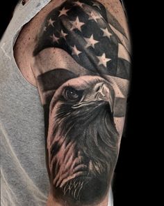 an eagle with the american flag on his arm