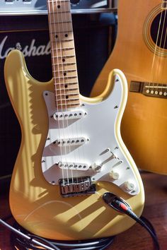 an electric guitar and amp are on display