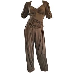 Utterly chic early 1990s / 90s EMANUEL UNGARO taupe silk jersey two piece harem pant set! Features a wonderful slinky draped short sleeve blouse, with a hidden zipper up the side. High waisted draped harem pants feature a button closure at waist, and zipper fly. Pockets at each side of the hips. Fantastic neutral color that is perfect all year, and matches everything. Great together, or as separates. In great condition. Made in Italy Approximately Size Small - Small Medium Measurements: (lots of Black Silk Jumpsuit, Suits Outfits, Vintage Jumpsuit, Silk Jumpsuit, Harem Pant, Black Kimono, Pant Suits, Tank Top Outfits, Vintage Trousers