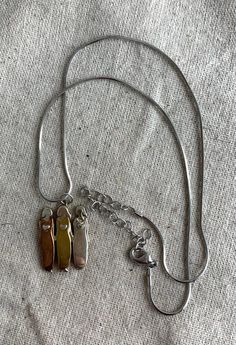 "You will receive this beautiful Three Sisters pendant necklace from Mama and Oly. The chain measures 18\" with a 3\" extender and the pendant measures 1 1/8\" x 3/4\" and features three women in different metal tones with hearts on their chests. The pendant is signed on the back. This necklace is in very good vintage condition with minimal signs of wear. For finished vintage assemblage and vintage inspired necklaces, bracelets, and earrings, please visit us at our other Etsy store, William Dalt Metal Necklaces For Friendship, Metal Friendship Necklaces, Friendship Pendant Necklace With Adjustable Chain, Metal Charm Necklace For Friendship, Metal Charm Necklaces For Friendship, Metal Friendship Charms Necklace, Metal Charm Necklace With 16 Inch Pendant, Metal Charm Necklace With 16 Inch Length, Personalized Metal Pendant Chain Necklace