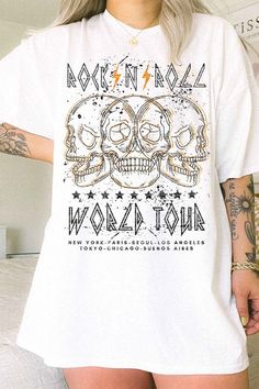 There's no need to buy tickets to a rock concert - this White Rock and Roll Tee is the VIP pass you need to rep your music fandom. The oversized graphic declares your cool style without any pesky lines or crowds. Rock on! Fabric & fit: Premium Cotton Oversized fit Model is wearing a size Small. Rock And Roll Letter Print T-shirt For Music Festival, Unisex Rock And Roll T-shirt For Concert, White Graphic Rock And Roll T-shirt, Rock And Roll Short Sleeve T-shirt With Text Print, Rock And Roll Cotton Graphic T-shirt, New York Tours, Varsity Letter, Oversized Graphic Tee, Rock Concert