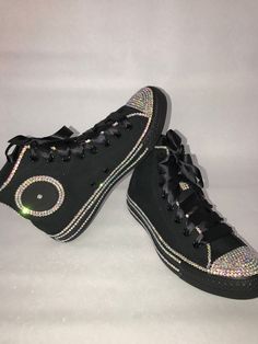 Custom Bling Converse All Star Chuck Taylor Sneakers. All designs handmade and embellished with a variety of high quality crystals. Great for weddings, proms, homecomings, birthdays, special events or just your everyday girly girl. **IF YOU NEED THIS ITEM BEFORE THE PROJECTED SHIPPING TIME YOU MUST CONTACT US BEFORE ORDERING (additional charges may apply) ** Shoe Details: Classic black on black high top Converse All Star Chuck Taylor Sneaker (cloth material style) Shoe Size: WOMEN'S size 6 to si Party Sneakers Embellished Black, Party Black Embellished Sneakers, Black Embellished Party Sneakers, Bling Converse, Sneakers High Top, Black High Top Converse, Bling Design, High Top Converse, Custom Bling