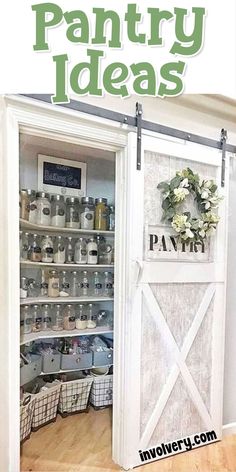 an open door to a pantry with jars and flowers on the shelves in front of it