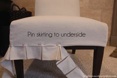 a white chair with the words pin sitting to underside on it