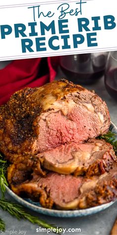 the best prime rib recipe on a platter with rosemary sprigs and wine