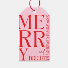 a pink gift tag with the words merry and bright in red on it's side